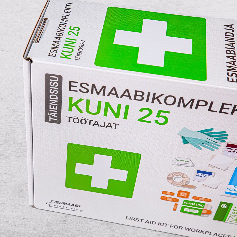 esmaabikomplekt pakend hallil taustal